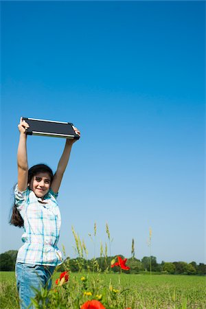 simsearch:600-07117293,k - Girl Holding Solar Panel up in the Air, Mannheim, Baden-Wurttemberg, Germany Stock Photo - Premium Royalty-Free, Code: 600-06808910