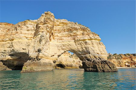 Atlantic Ocean and Cliffs with Natural Arches between Armacao de Pera and Portimao, Benagil, Lagoa, Portugal Stock Photo - Premium Royalty-Free, Code: 600-06841799