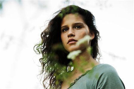 simsearch:600-06786760,k - Portrait of teenaged girl outdoors in nature, looking into the distance, Germany Stock Photo - Premium Royalty-Free, Code: 600-06899834