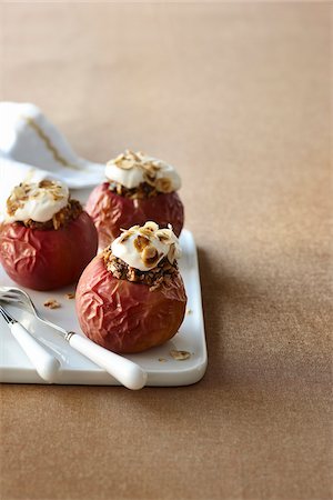 simsearch:600-05973291,k - Baked Red Apples Stuffed with Oatmeal, Granola and Yogurt, Studio Shot Stock Photo - Premium Royalty-Free, Code: 600-06892677
