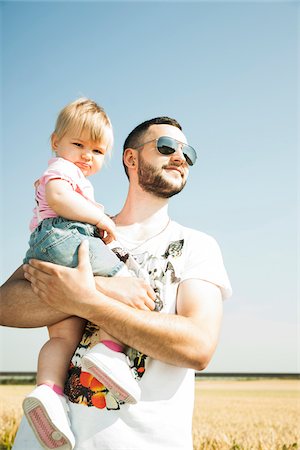 simsearch:700-06962061,k - Father Holding Baby Daughter Outdoors, Mannheim, Baden-Wurttemberg, Germany Stock Photo - Premium Royalty-Free, Code: 600-06892758
