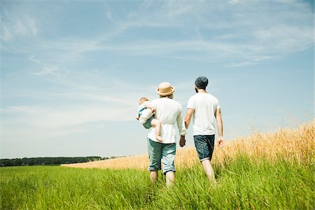 family lifestyle - Family Walking by Agricultural Field, Mannheim, Baden-Wurttemberg, Germany Stock Photo - Premium Royalty-Free, Code: 600-06892772