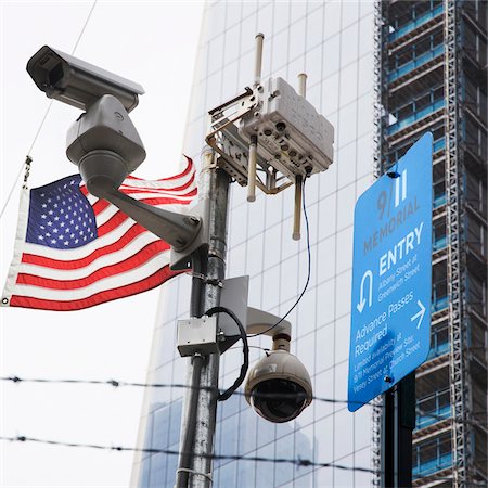 simsearch:700-07529142,k - Surveillance Cameras and American Flag by One World Trade Center, New York City, New York, USA Stock Photo - Premium Royalty-Free, Code: 600-06939612