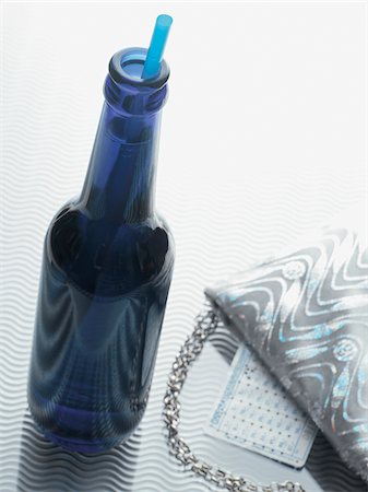 Bottle of Alcopop with Evening Bag, Studio Shot Stock Photo - Premium Royalty-Free, Code: 600-06961856
