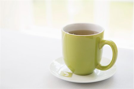 Cup of Tea in Green Mug with Saucer, Studio Shot Stock Photo - Premium Royalty-Free, Code: 600-07066874