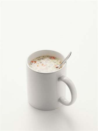 simsearch:600-07067016,k - Soup and spoon in white mug, on white background, studio shot Stock Photo - Premium Royalty-Free, Code: 600-07067118