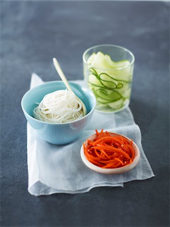 food in containers - Vietnamese Ingredients, Rice Noodles, Pickled Cucumbers and Carrots for Banh Mi Sandwich, Studio Shot Stock Photo - Premium Royalty-Free, Code: 600-07067599