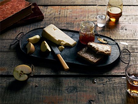 simsearch:700-03805242,k - Cheese Board with Cheese, Bread, Jam and Apple Slices, Studio Shot Stock Photo - Premium Royalty-Free, Code: 600-07067644