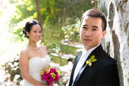 simsearch:600-07067600,k - Portrait of Groom with Bride in the background, Toronto, Ontario, Canada Stock Photo - Premium Royalty-Free, Code: 600-07117242