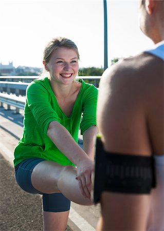 Young Couple Stretching before Running, Worms, Rhineland-Palatinate, Germany Photographie de stock - Premium Libres de Droits, Code: 600-07110548