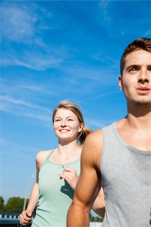 sport man - Young Couple Running, Worms, Rhineland-Palatinate, Germany Stock Photo - Premium Royalty-Free, Code: 600-07110583