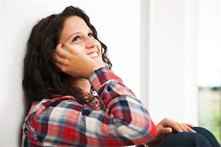 simsearch:600-06899843,k - Close-up of teenage girl sitting next to window and talking on cell phone, Germany Stock Photo - Premium Royalty-Free, Code: 600-07148167