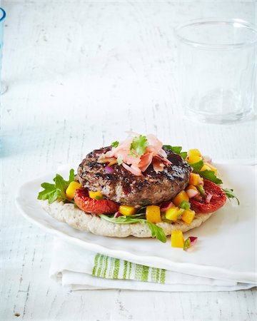 spices - Fresh Burger on plate, studio shot Stock Photo - Premium Royalty-Free, Code: 600-07156138