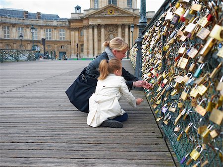 paris landmark - Mother and Daughter looking at Love Locks on Pont Des Arts, Paris, France Stock Photo - Premium Royalty-Free, Code: 600-07199703
