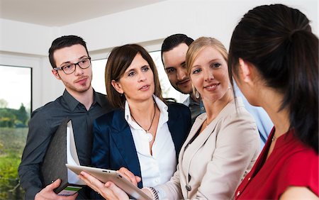 simsearch:600-07202762,k - Group of young business people and businesswoman in discussion in office, Germany Stock Photo - Premium Royalty-Free, Code: 600-07199952