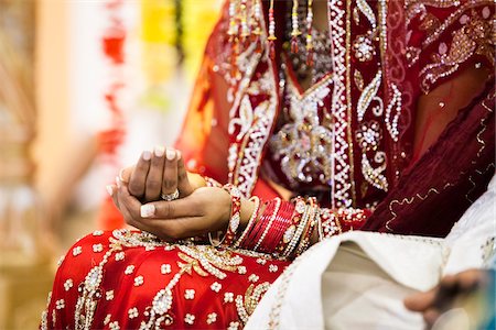 saree couples - Close-up of Woman's Hands during Hindu Wedding Ceremony, Toronto, Ontario, Canada Stock Photo - Premium Royalty-Free, Code: 600-07204149