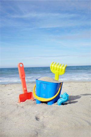 shovel (hand tool for digging) - Toy Bucket, Shovel and Rake in Sand at Beach, Saint-Jean-de-Luz, Pyrenees-Atlantiques, France Stock Photo - Premium Royalty-Free, Code: 600-07279374