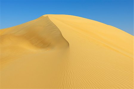 simsearch:846-02796313,k - Top of Sand Dune aganist Blue Sky, Matruh, Great Sand Sea, Libyan Desert, Sahara Desert, Egypt, North Africa, Africa Stock Photo - Premium Royalty-Free, Code: 600-07431220