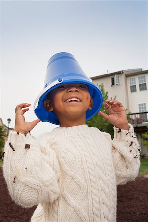 simsearch:600-05653250,k - Portrait of Boy with Blue Bucket on his Head, Maryland, USA Stock Photo - Premium Royalty-Free, Code: 600-07529186