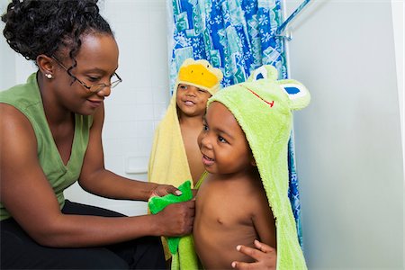 siblings bathing - Mother Helping Boys put on Hooded Towels after Bath Stock Photo - Premium Royalty-Free, Code: 600-07529183