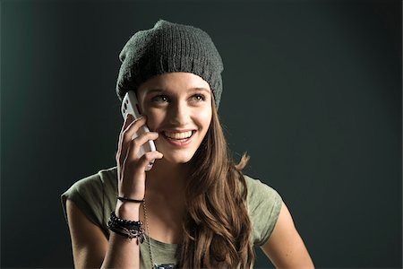 simsearch:600-03244230,k - Portrait of Teenage Girl using Cell Phone, Studio Shot Stock Photo - Premium Royalty-Free, Code: 600-07562457