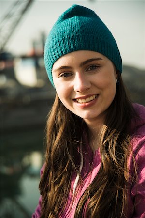 simsearch:600-06899843,k - Close-up portrait of teenage girl outdoors wearing toque, smiling and looking at camera, Germany Stock Photo - Premium Royalty-Free, Code: 600-07584775