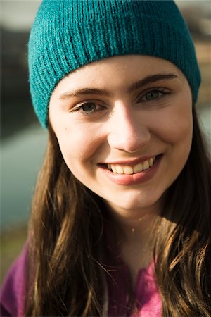 simsearch:600-06899843,k - Close-up portrait of teenage girl outdoors wearing toque, smiling and looking at camera, Germany Stock Photo - Premium Royalty-Free, Code: 600-07584777