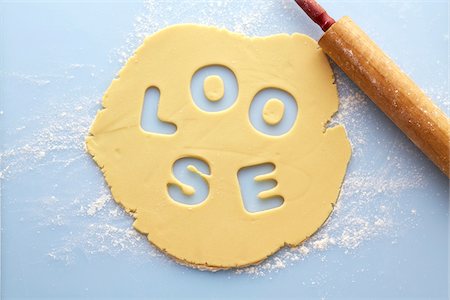 flour - Overhead View of Rolled out Suger Cookie Dough with LOOSE cut out of it, Studio Shot Stock Photo - Premium Royalty-Free, Code: 600-07784429