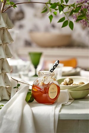 Fig Preserves on Rustic Dining Room Table Stock Photo - Premium Royalty-Free, Code: 600-07784437