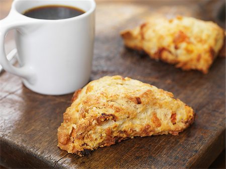 simsearch:700-03698239,k - Pumpkin Spice Scones on Cutting Board with Cup of Coffee Stock Photo - Premium Royalty-Free, Code: 600-07810529
