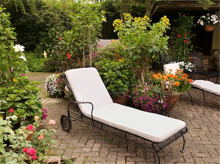 simsearch:600-05602737,k - Private Patio and Garden of Home with Lounge Chair and Towels, Toronto, Ontario, Canada Stock Photo - Premium Royalty-Free, Code: 600-07810522