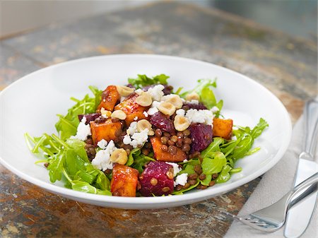 Lentil Salad with Greens, Beets, Feta Cheese, Hazelnuts and Sweet Potato, Studio Shot Stock Photo - Premium Royalty-Free, Code: 600-07810537