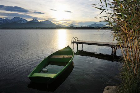 simsearch:649-07520952,k - Rowboat with Sun Reflecting on Lake, Hopfen am See, Lake Hopfensee, Bavaria, Germany Stock Photo - Premium Royalty-Free, Code: 600-07844549