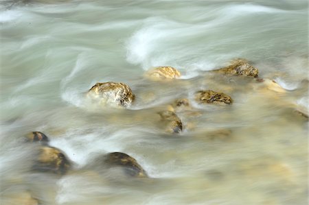 simsearch:600-07848052,k - Close-up of flowing water and rocks in Partnach Gorge in autumn, Upper Bavaria, Germany Stock Photo - Premium Royalty-Free, Code: 600-07911258