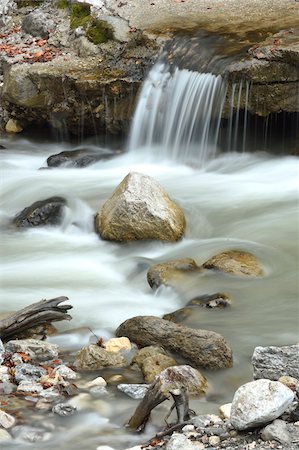 simsearch:600-07848052,k - Close-up scene of flowing water and rocks in the Partnach Gorge in autumn, Upper Bavaria, Germany Stock Photo - Premium Royalty-Free, Code: 600-07911261