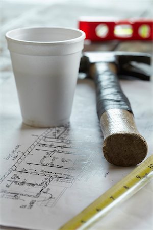 Home Renovation Still Life with Hammer, Blueprint, Styrofoam Coffee Cup, Tape Measure and Level Stock Photo - Premium Royalty-Free, Code: 600-07958197