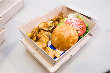 Hamburger and Potato Chips in Take-out Box, Studio Shot Stock Photo - Premium Royalty-Free, Code: 600-07991480