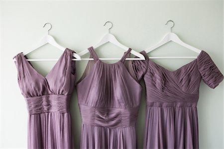 simsearch:700-05786438,k - Three Bridesmaid Dresses Hanging on Wall Stock Photo - Premium Royalty-Free, Code: 600-07991592