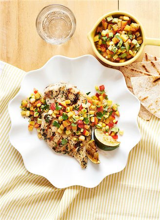 dinner - Southwest style chicken with salsa and tortillas on white plate, studio shot Stock Photo - Premium Royalty-Free, Code: 600-08002166