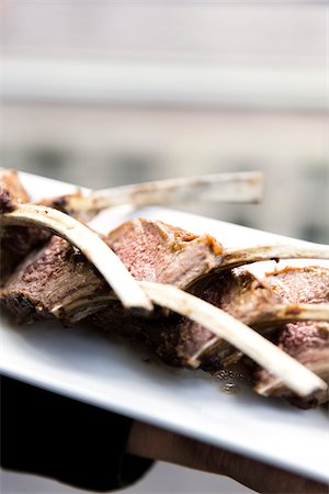 serving gourmet food - Close-up of lamb chops with bones on a platter, at an event, Canada Stock Photo - Premium Royalty-Free, Code: 600-08002538