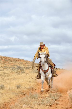 equidae - Cowboy Riding Horse with Rope in Hand, Shell, Wyoming, USA Stock Photo - Premium Royalty-Free, Code: 600-08082912