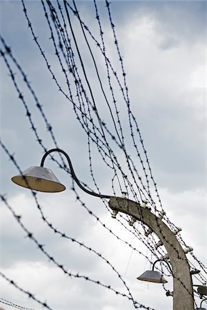 european war nazi - Barbed Wire and Light, Auschwitz, Oswiecim, Poland Stock Photo - Premium Royalty-Free, Code: 600-08212935