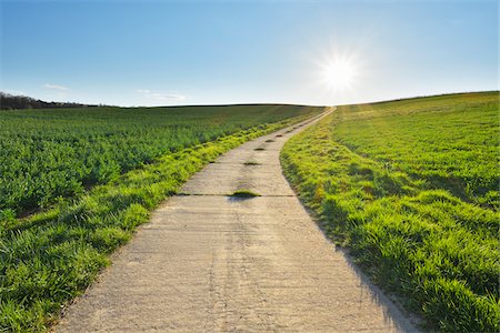 simsearch:600-03171596,k - Road through Field with Sun, Helmstadt, Franconia, Bavaria, Germany Stock Photo - Premium Royalty-Free, Code: 600-08232271