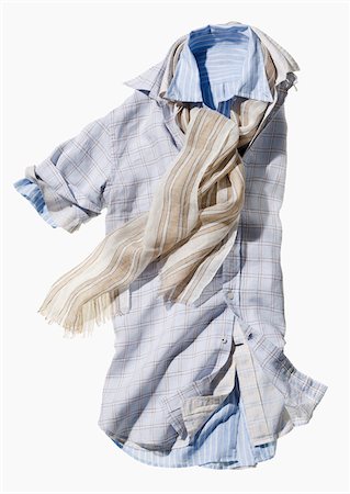 simsearch:600-08353424,k - Three short sleeved shirts inside each other with light scarf on white background Stock Photo - Premium Royalty-Free, Code: 600-08353439