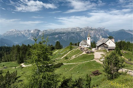 Scenic view of mountains with the beautiful little Church of the Holy Cross, Badia Valley, Dolomites, South Tyrol, Italy Stock Photo - Premium Royalty-Free, Code: 600-08386023