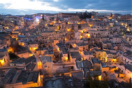 dwelling - Overview of Sassi di Matera at dusk, one of the three oldest cities in the world, Matera, Basilicata, Italy Stock Photo - Premium Royalty-Free, Code: 600-08416780