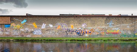 Graffiti on Brick Wall next to Canal, Hackney Wick, London, UK Stock Photo - Premium Royalty-Free, Code: 600-08512523