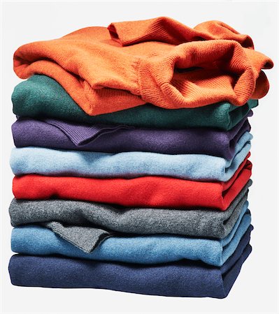 simsearch:600-08353424,k - Stack of different coloured sweaters on white background Stock Photo - Premium Royalty-Free, Code: 600-08542889