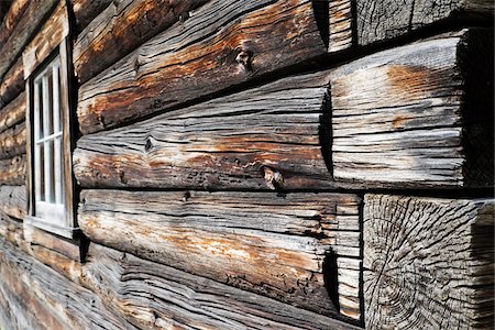 Close-up of weathered logs on traditional wooden building at Barkerville Historic Town in British Columbia, Canada Stock Photo - Premium Royalty-Free, Code: 600-08657517