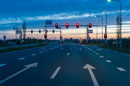 simsearch:700-02082042,k - Road Intersection with Red Traffic Light at Dusk, Netherlands Stock Photo - Premium Royalty-Free, Code: 600-08865414